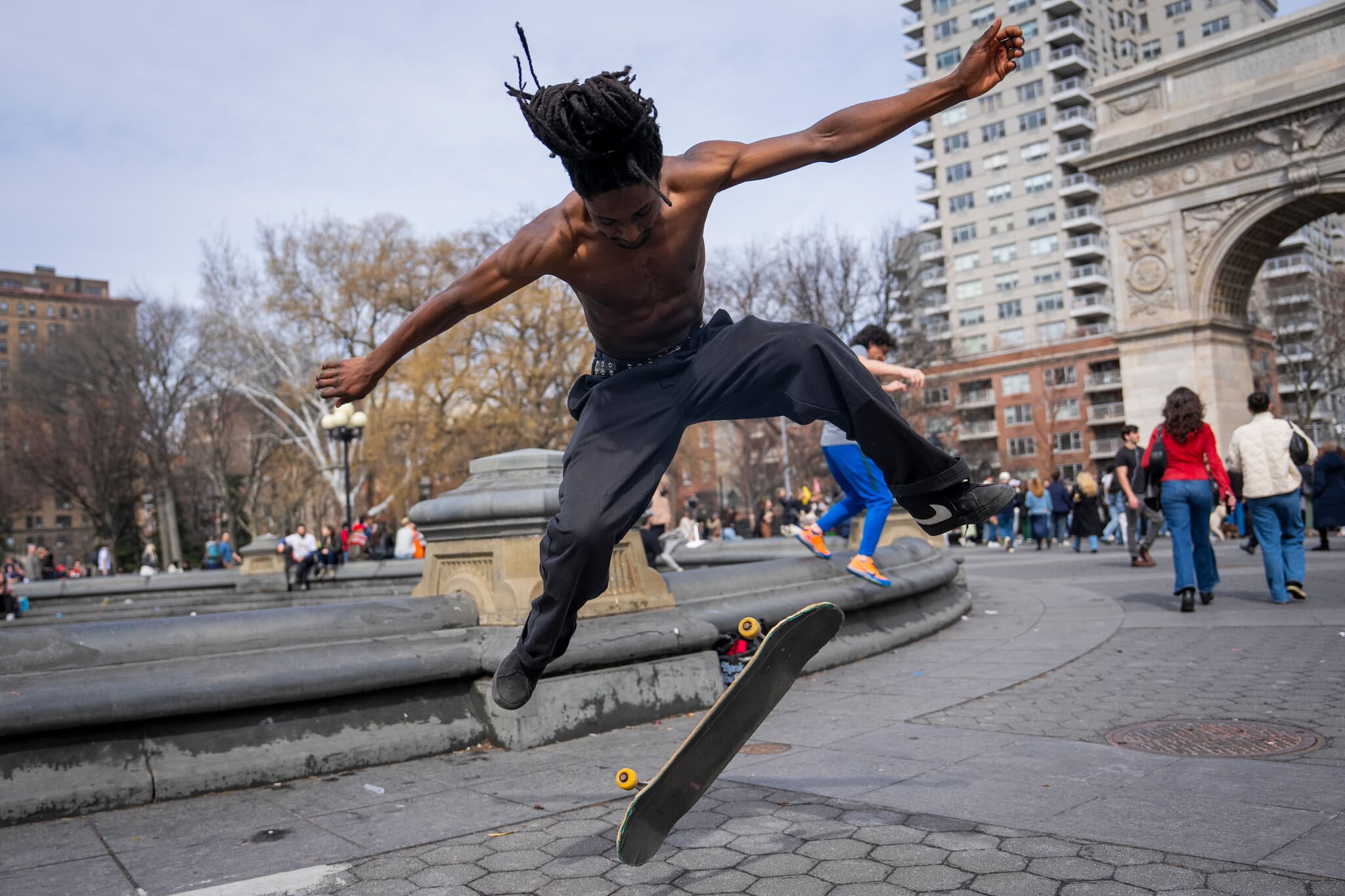 A Warm Day Arrives and New Yorkers Rush Into Spring’s Embrace
