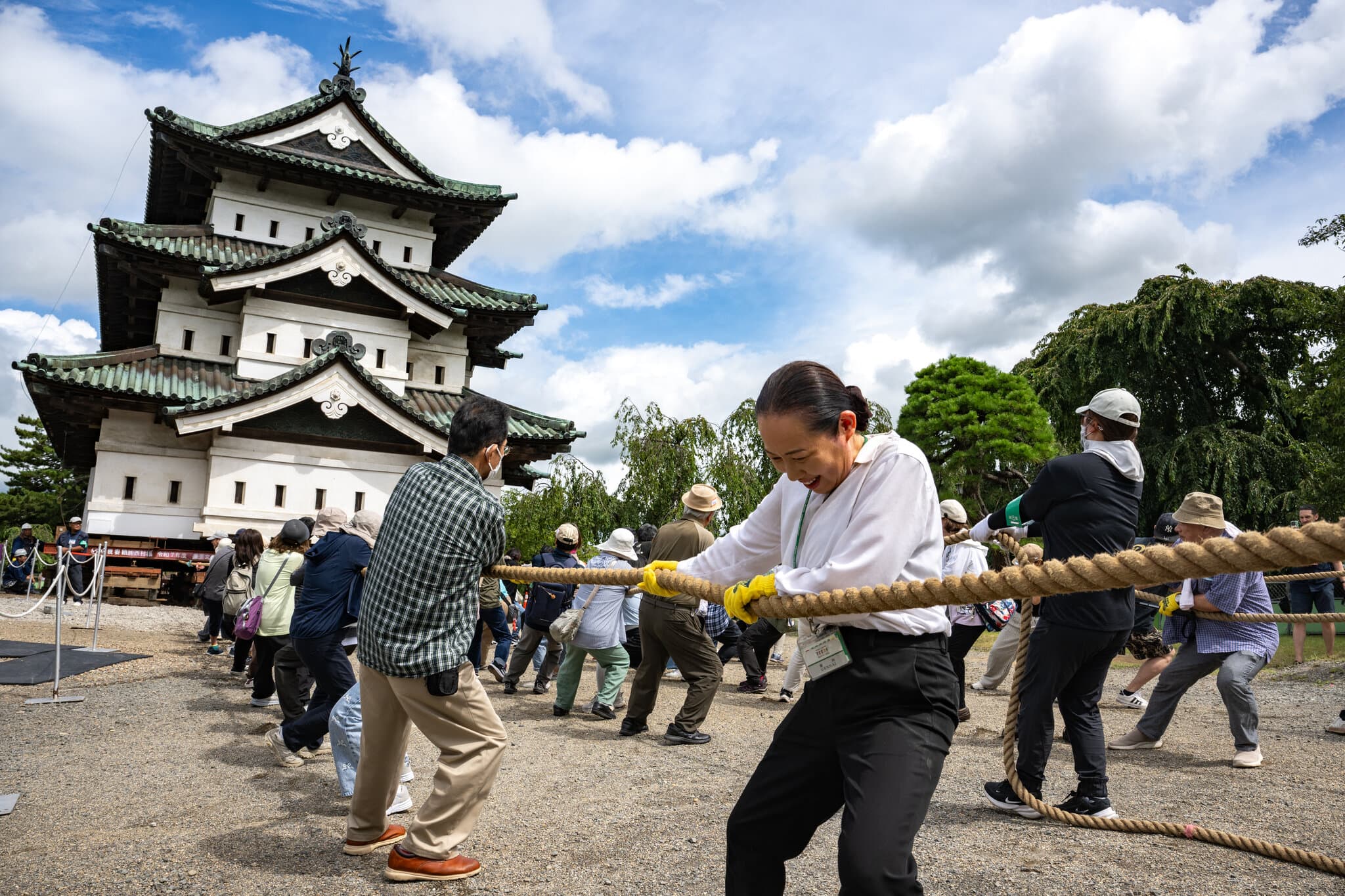 A City Unites Around a Common Goal: Moving a Castle by Hand
